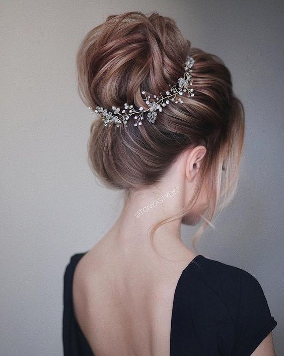 messy bun  Hairstyles For Wedding Guest