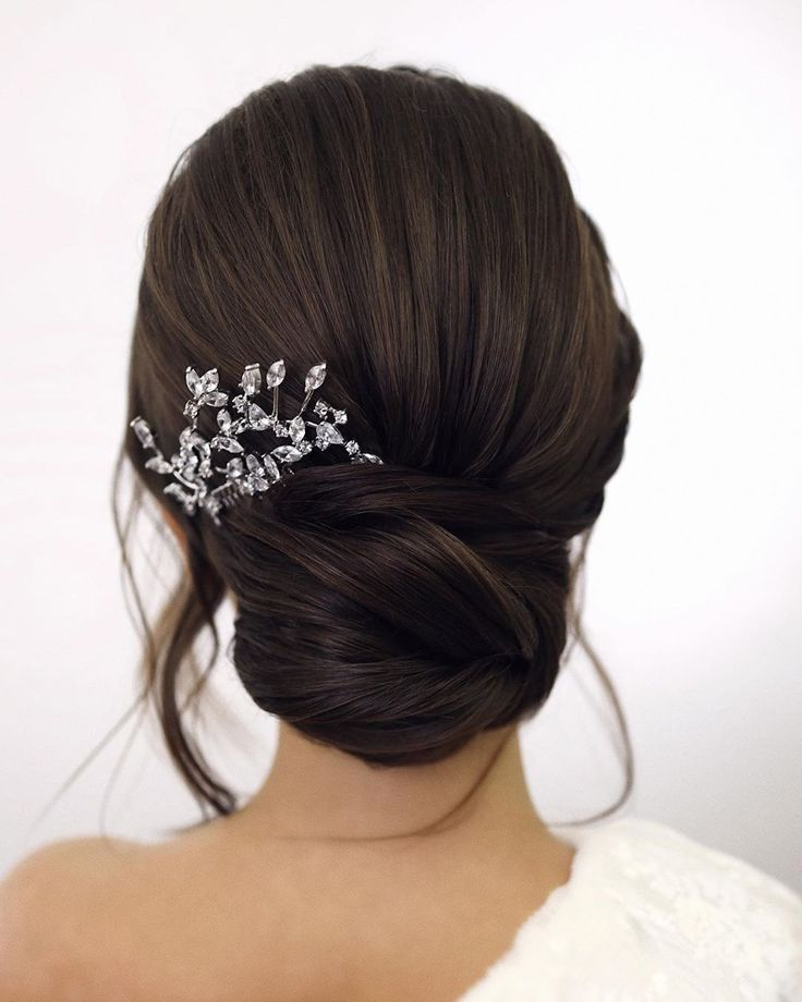 polished bellerina bun Hairstyles For Wedding Guest